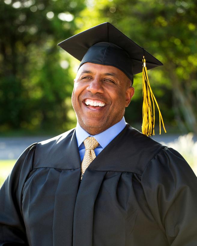 Man in a graduation cap and gown
