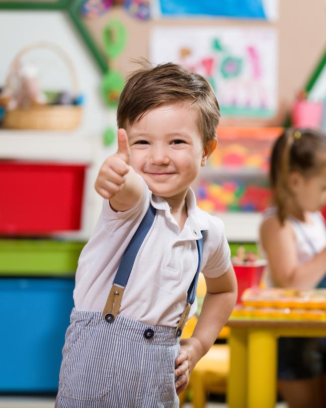 Kid giving thumbs up