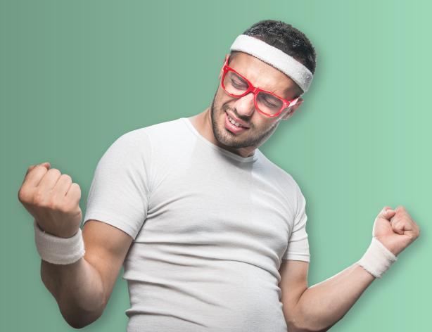 man in sweatbands flexing