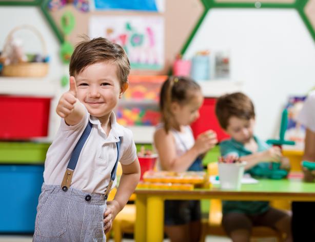 Kid giving thumbs up