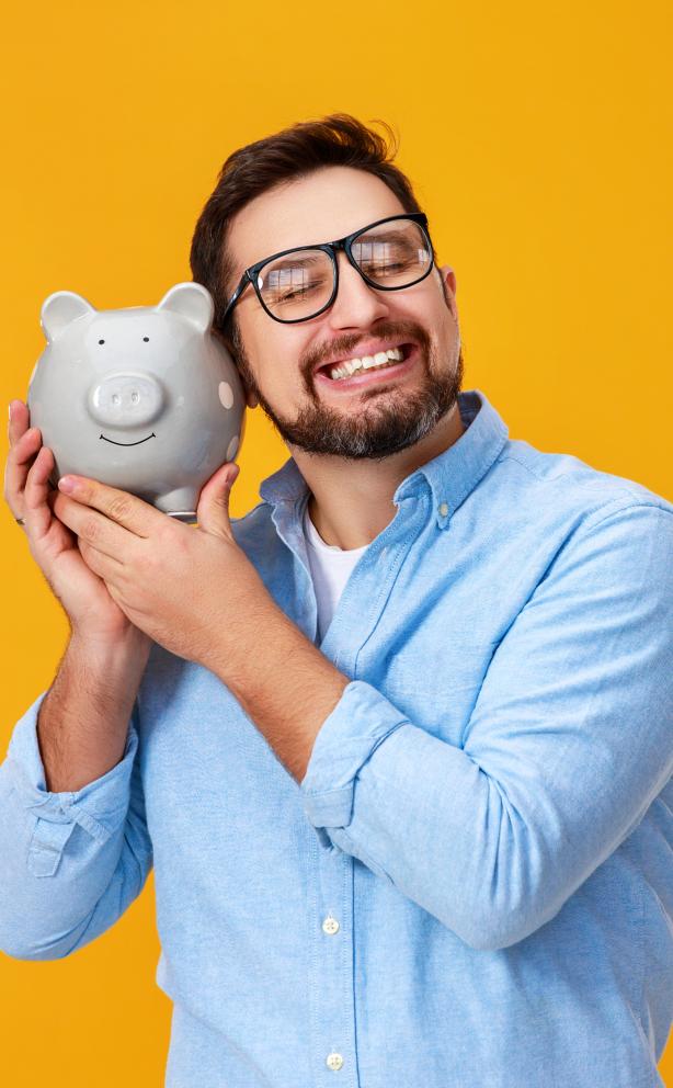 happy man holding piggy bank