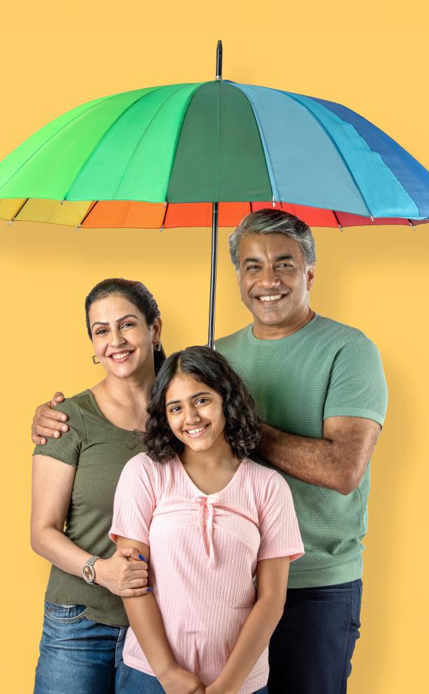 Parents and daughter with umbrella.