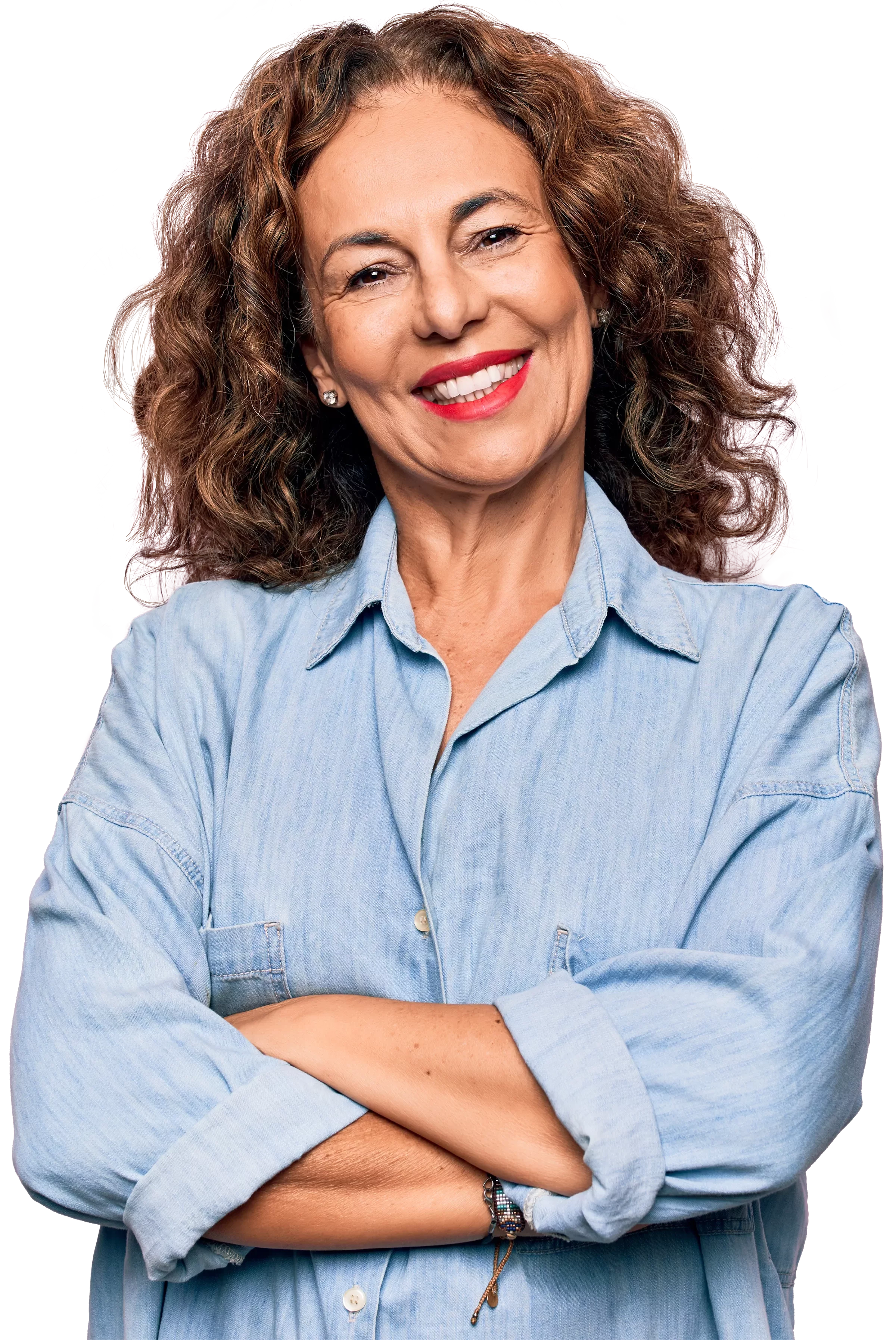 Content, relaxed woman with curly hair in a blue shirt. Her arms are crossed.