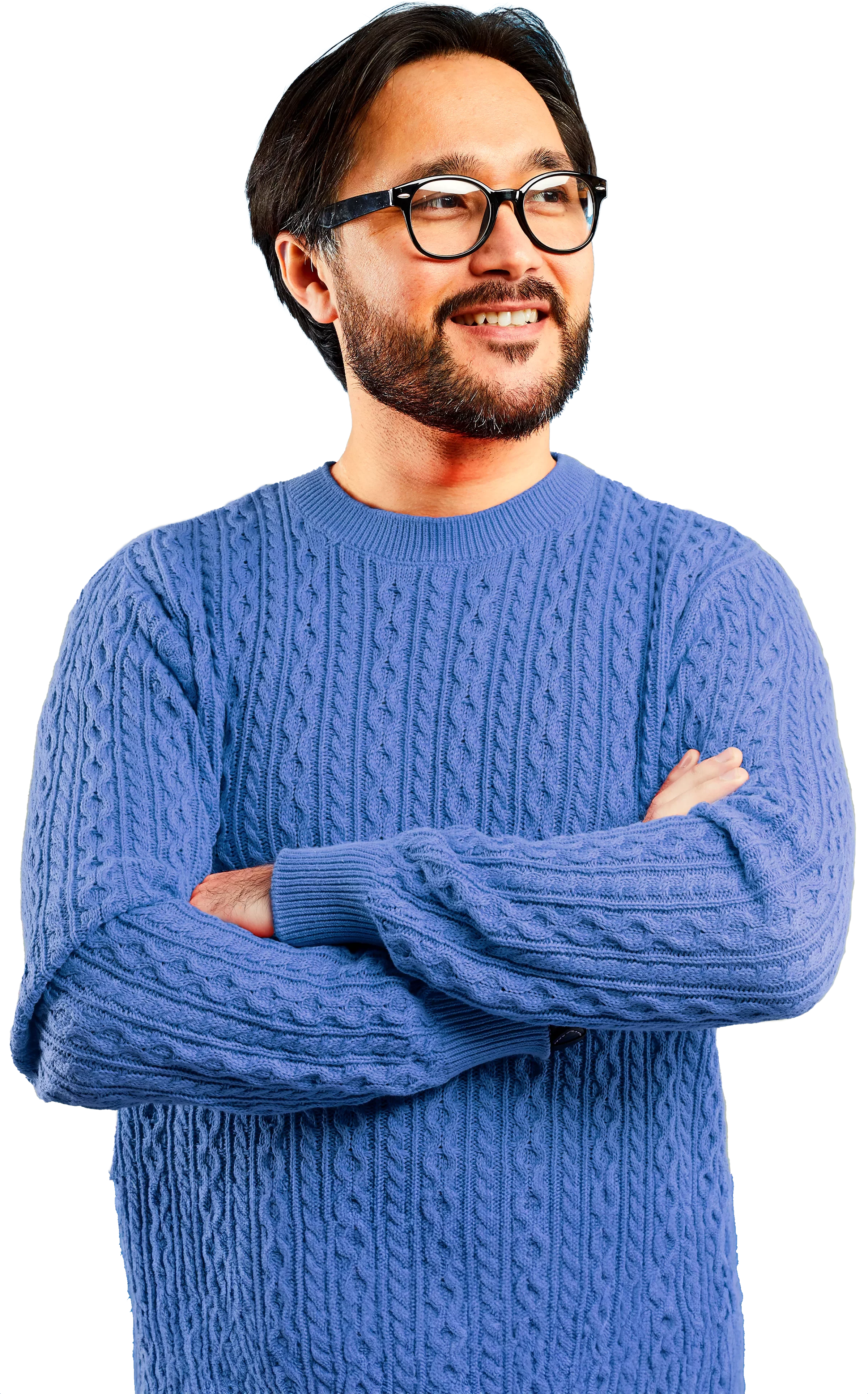 Happy man in sweater looking right with arms crossed